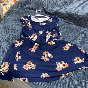 Navy blue flowered baby doll dress that comes right at the knee.  Stretch
